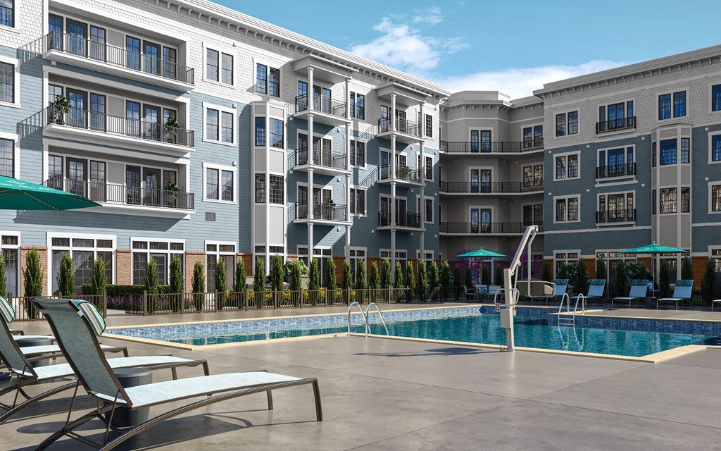 a swimming pool in front of an apartment building