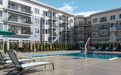 a swimming pool in front of an apartment building