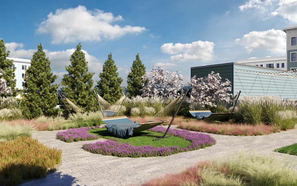 a landscaped garden with boats and trees and buildings