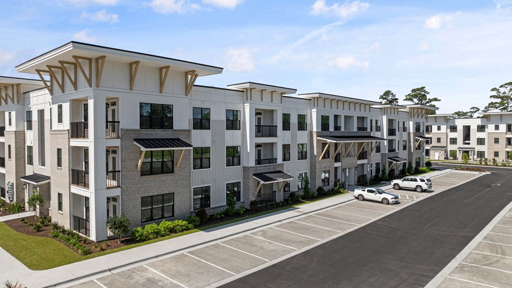 a city with a lot of buildings and a blue sky