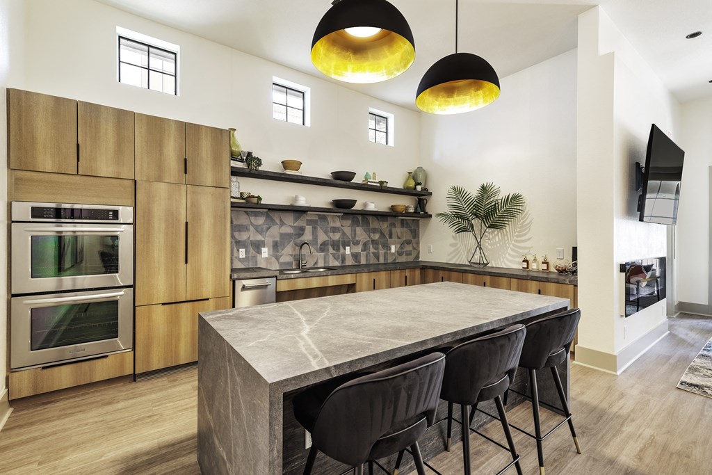 A Kitchen and Wooden Cabinets at 3500 Westlake Apartments, Austin, TX, 78746