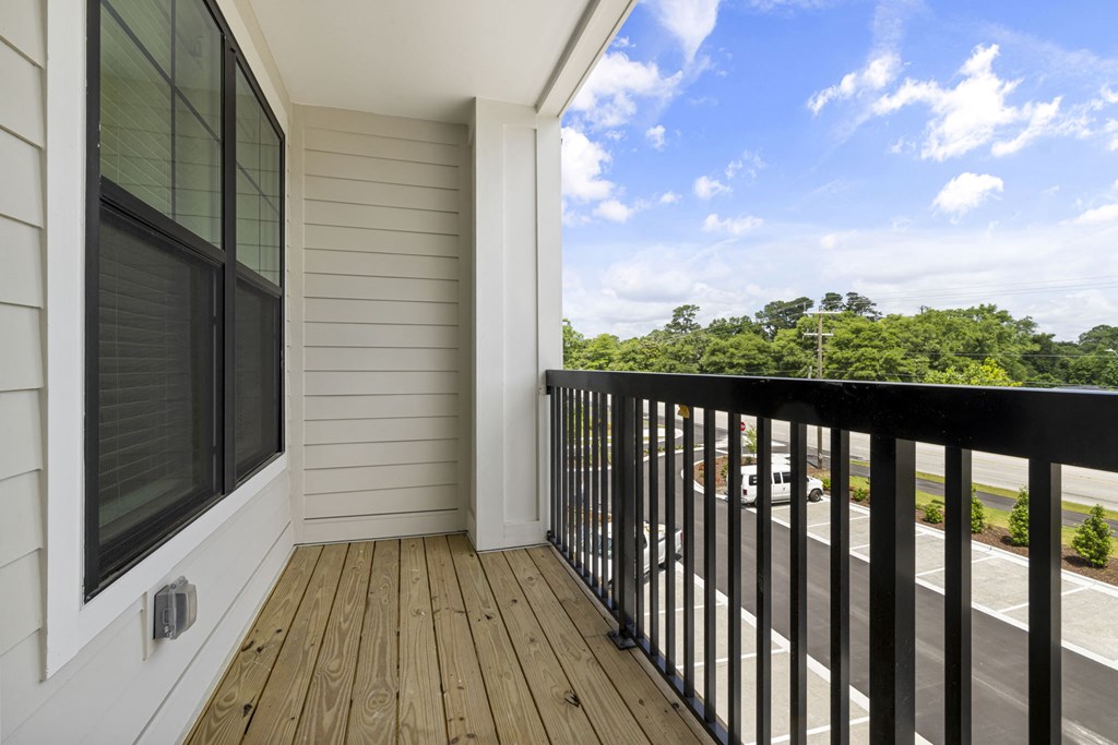 a balcony with a view of the ocean and the sky