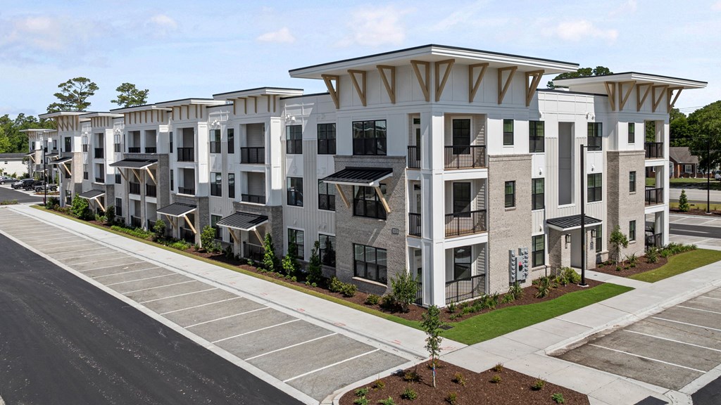 an aerial view of a building with balconies and a courtyard