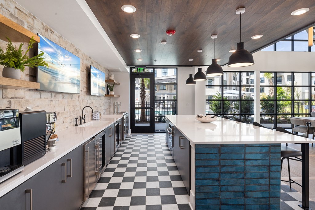 a kitchen with a large counter and a large window
