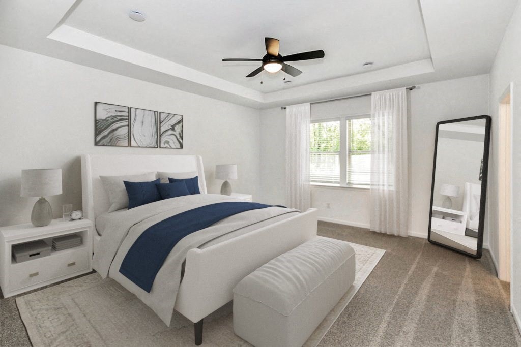 a bedroom with a bed and a ceiling fan