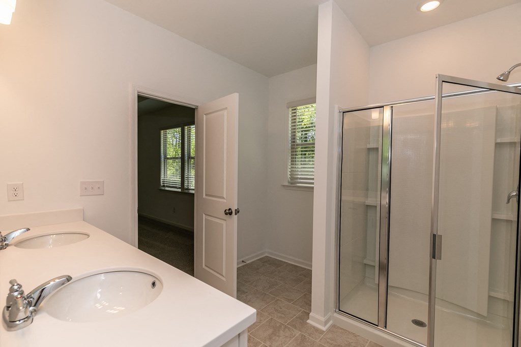 a bathroom with a sink and a shower