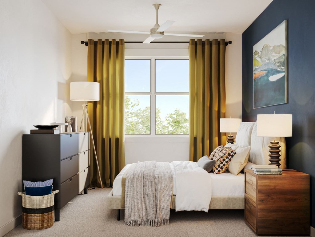 a bedroom with a bed and a window with yellow curtains