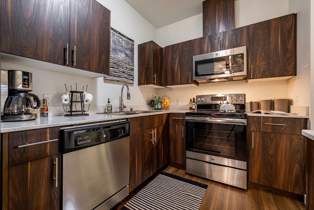 Kitchen showing appliances and sink