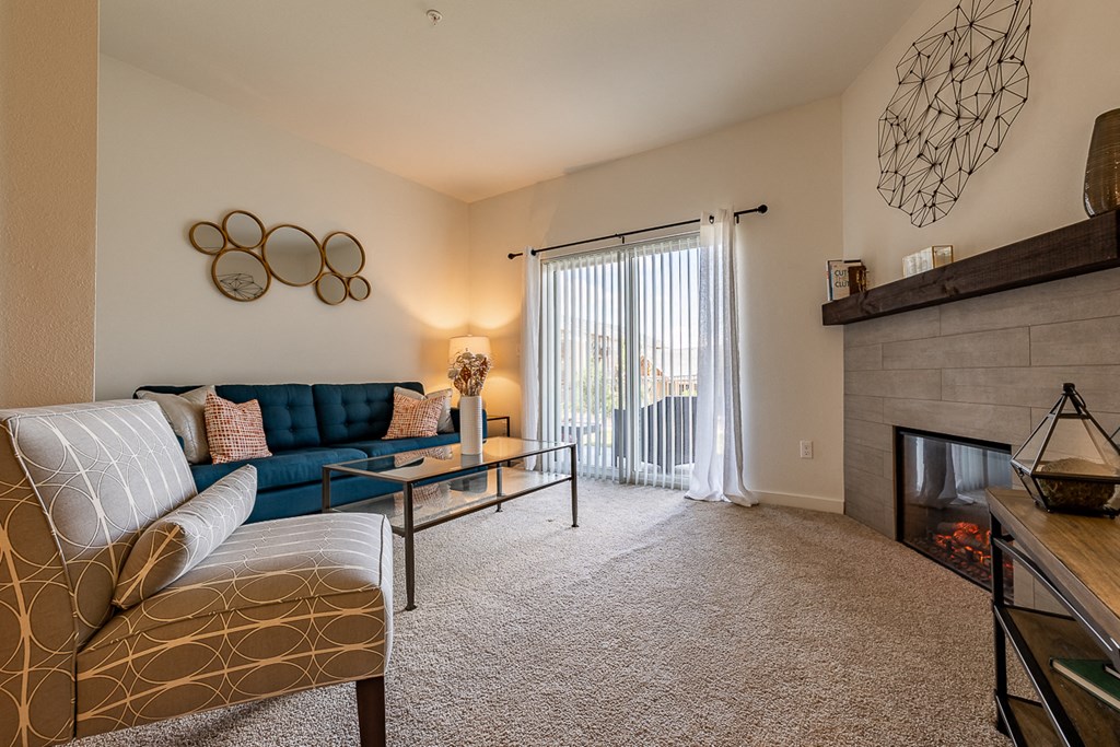 Living room with fireplace and sliding door to patio