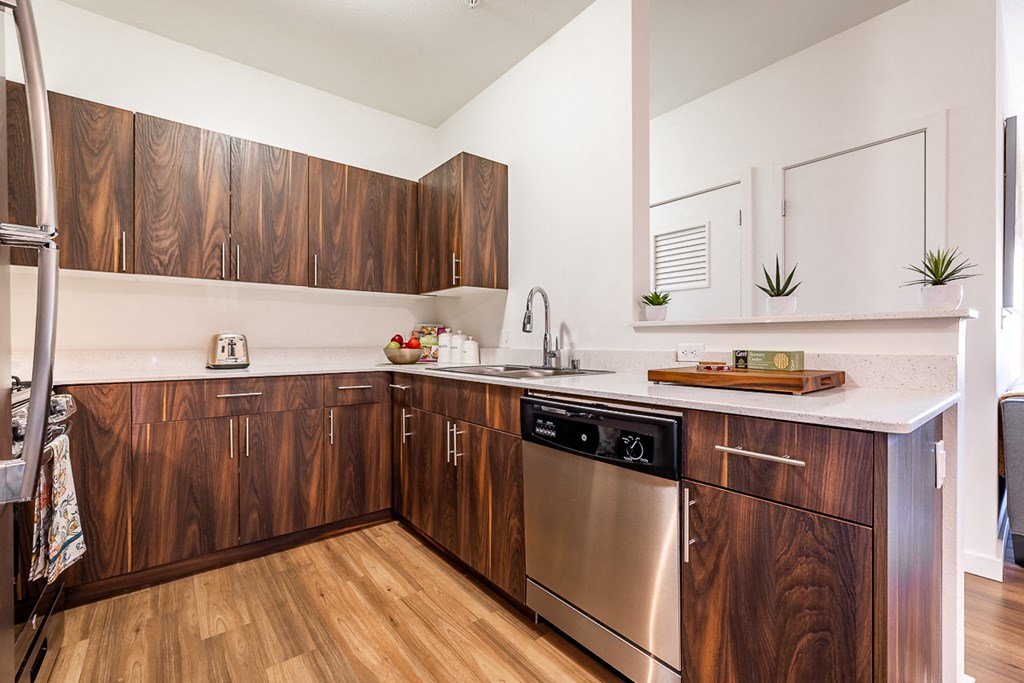 Kitchen showing dishwasher and sink