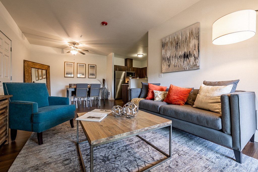 living room with couch, coffee table, and chair