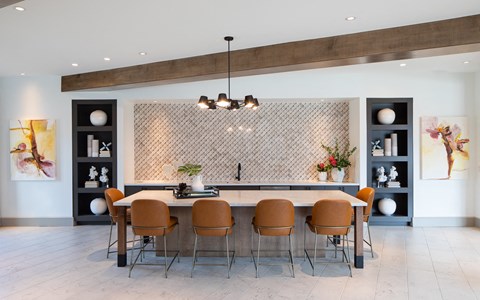a large dining room with a large table and chairs