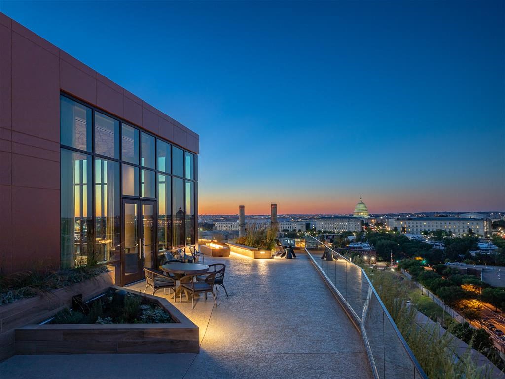 a building with a view of the capitol building at night