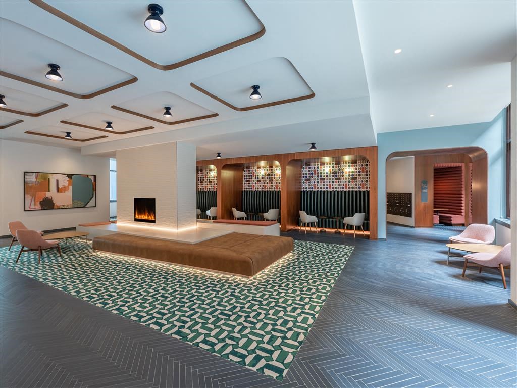 a hotel room with a bed and a fireplace