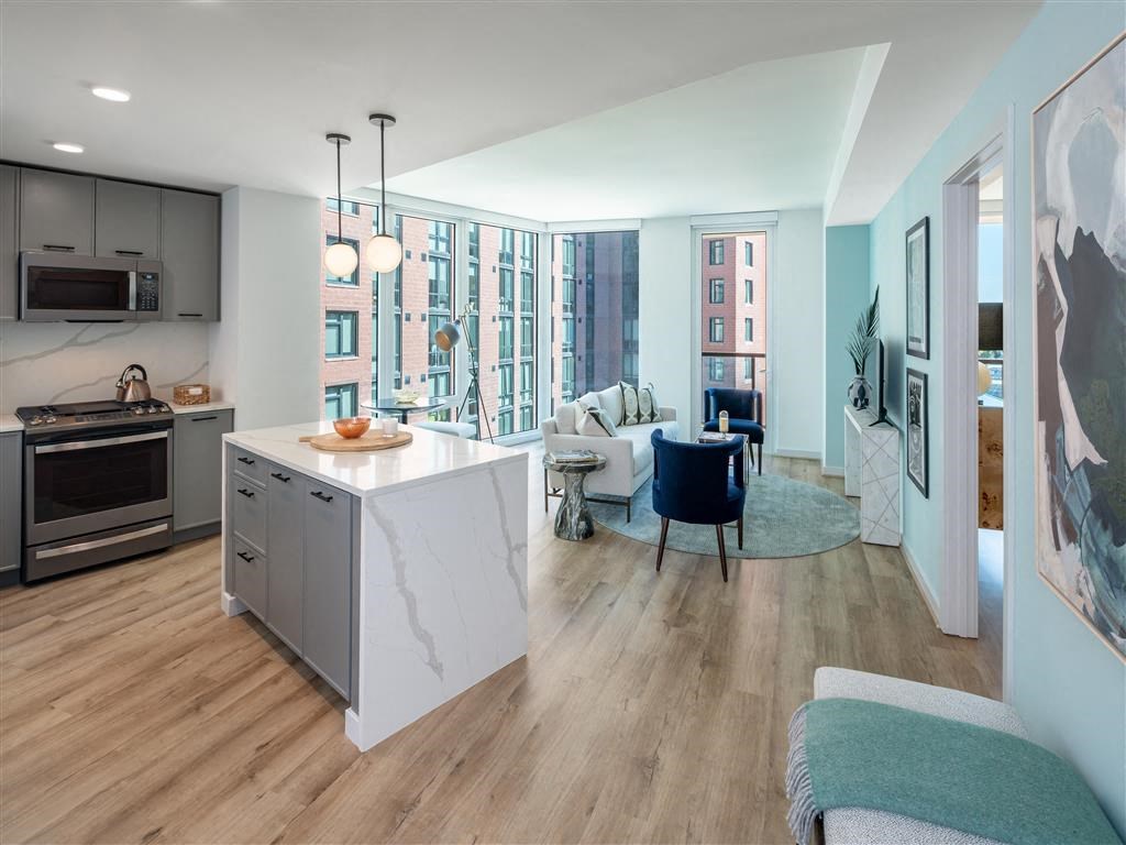 a kitchen and living room with an open floor plan