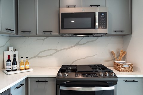 a kitchen with a stove and a microwave