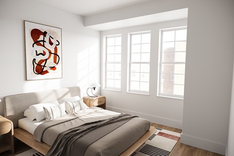 A bedroom with a bed, a lamp, and a painting on the wall.
