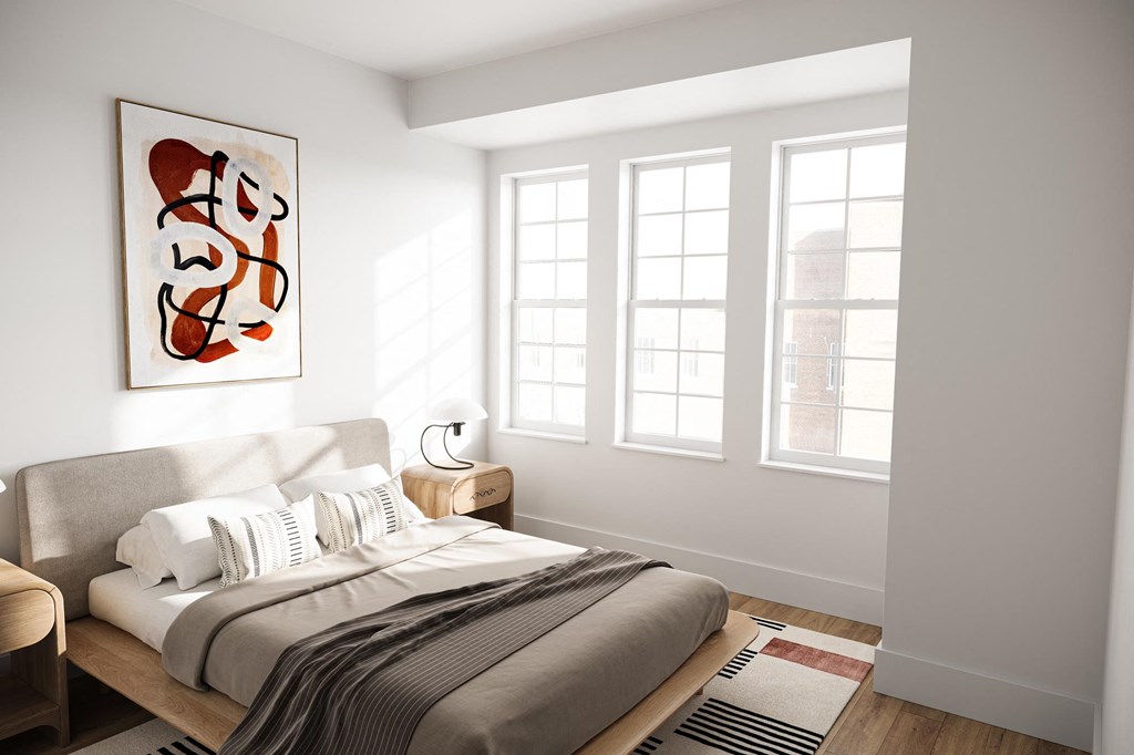 a bedroom with a large bed and a large painting on the wall