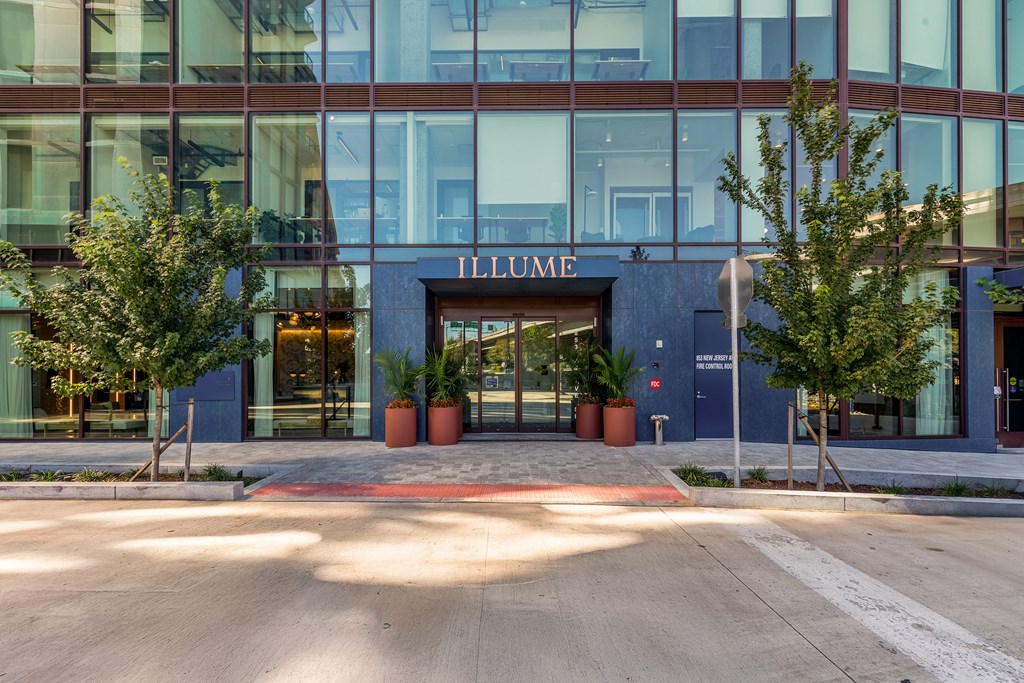 The front of a building with the word "ILLUMEN" on it.