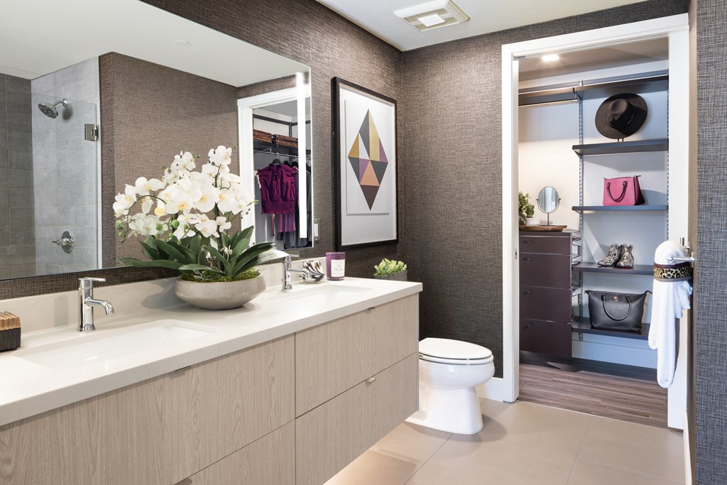 a bathroom with a large sink and a toilet