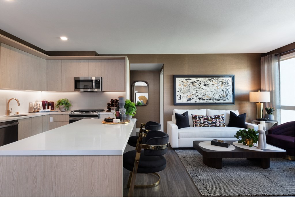 a living room with a white couch and a coffee table