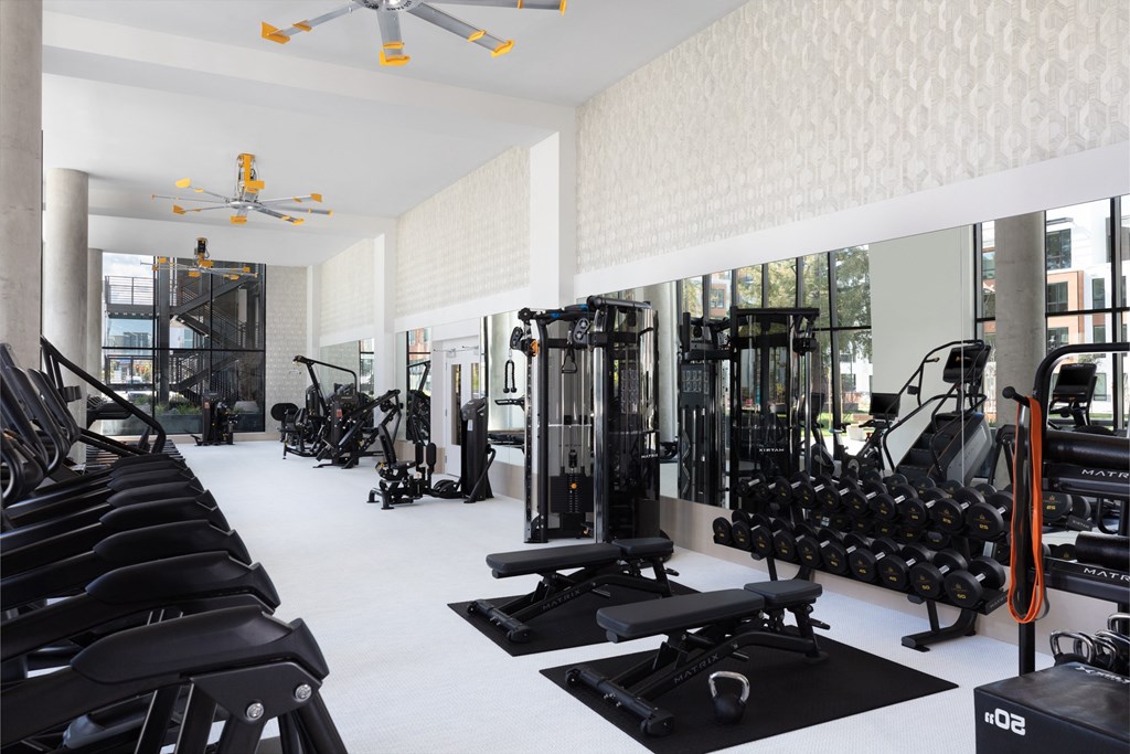 a room filled with lots of different types of exercise equipment