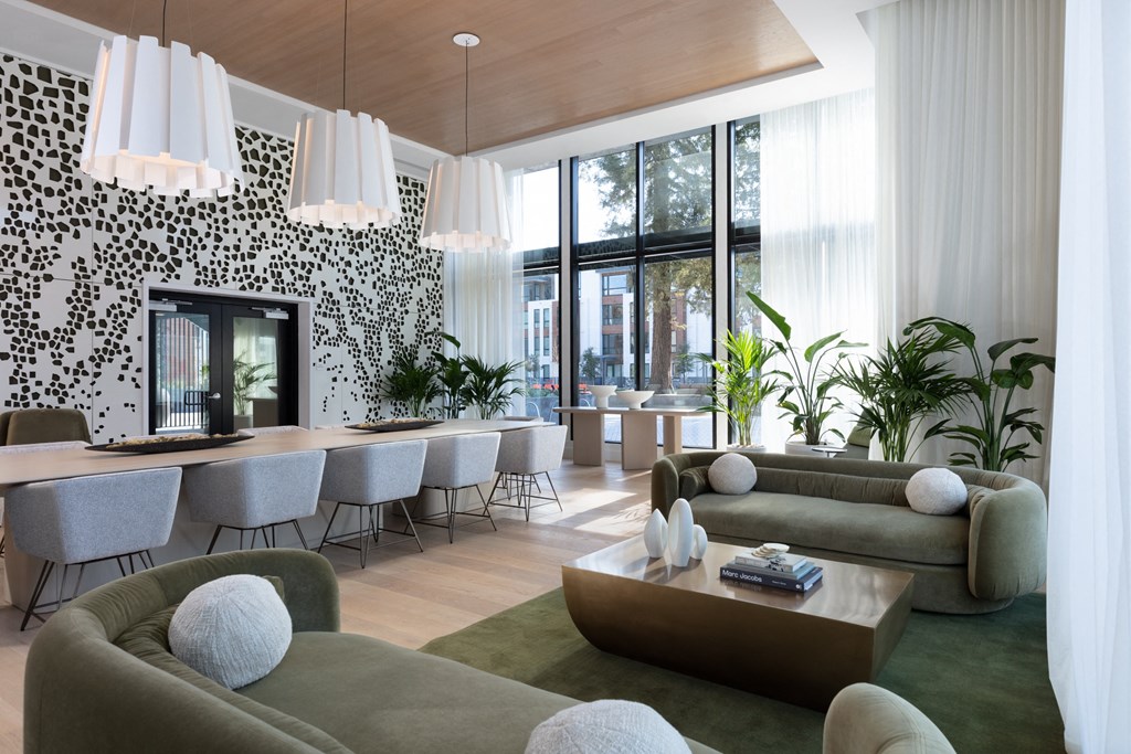 a rendering of a living room with green couches and a coffee table