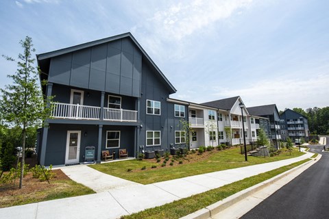 Exterior community with a sidewalk in front of them