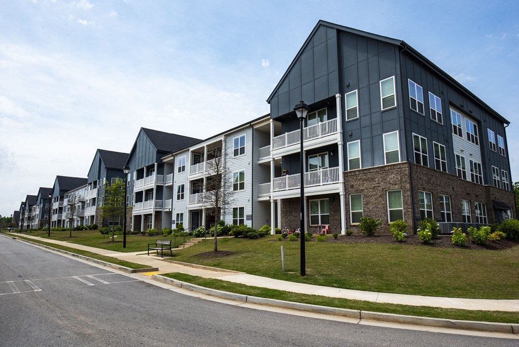 an apartment building on the corner of a street