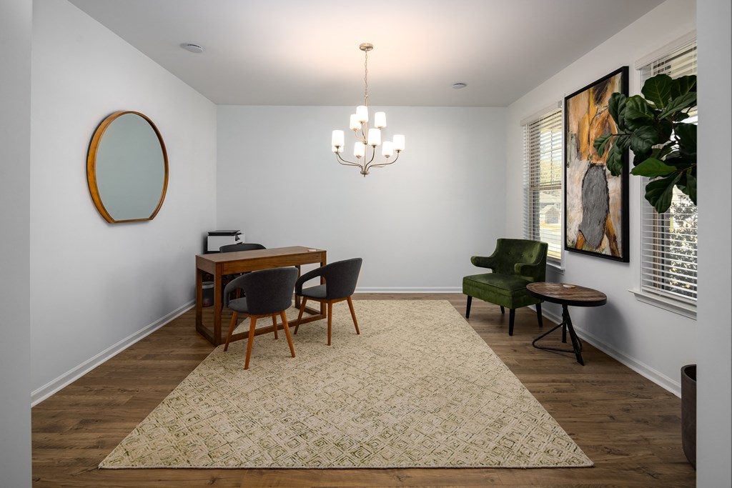 a dining room with a table and chairs and a chandelier