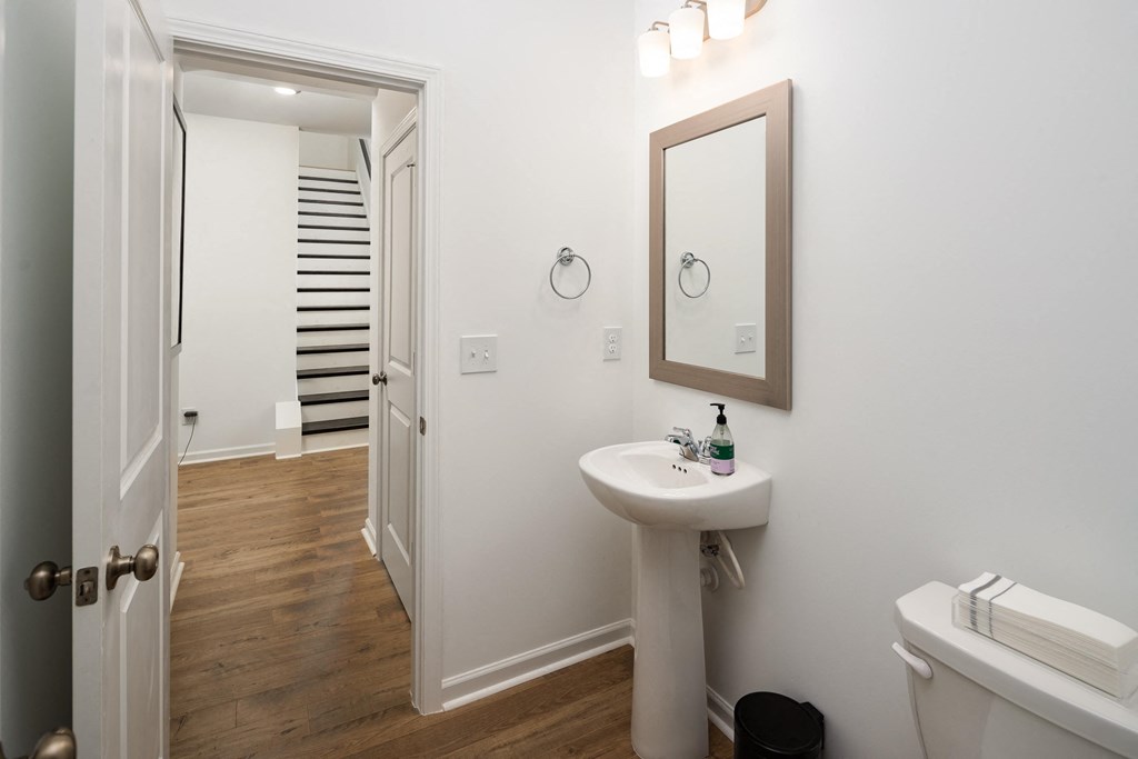 a small bathroom with a sink and a mirror and a toilet