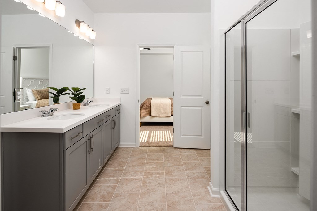 a bathroom with a sink and a shower