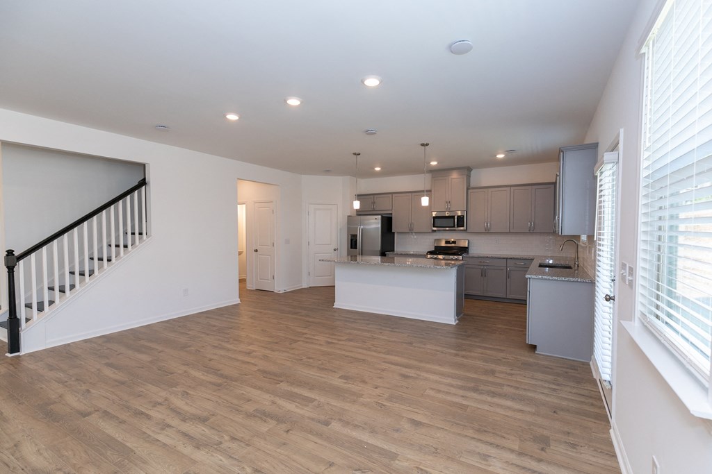 a kitchen and living room in a house