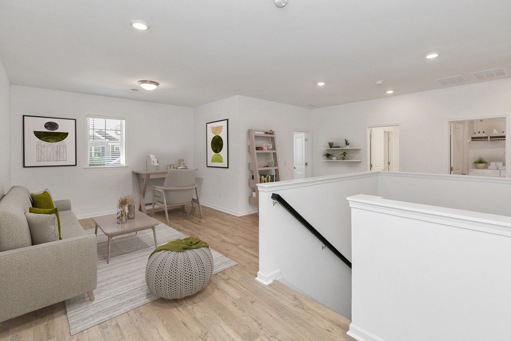 a living room and dining room with white walls and hardwood floors