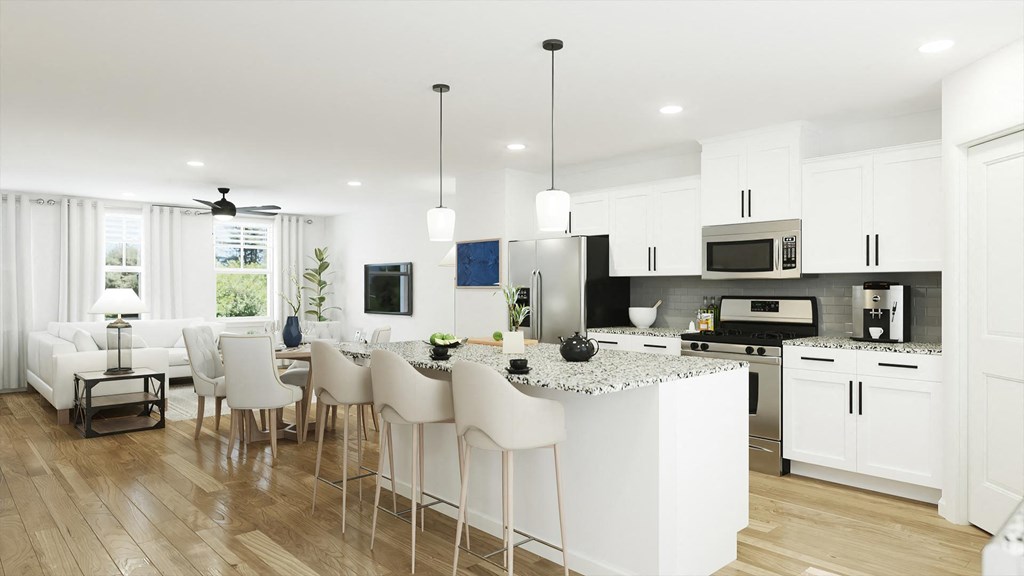 an open concept kitchen and living room with white cabinets and a white island with granite countertops