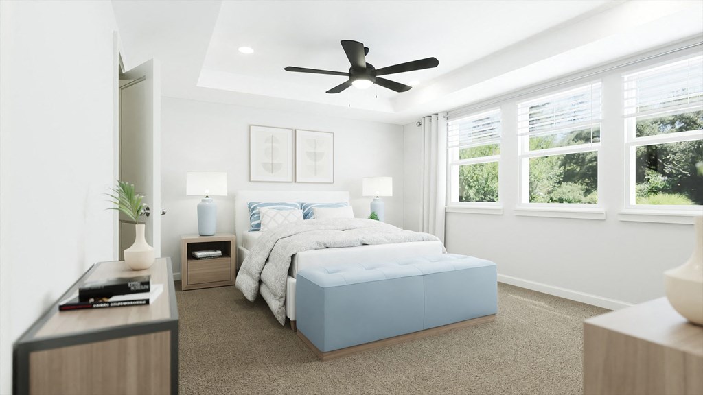 a bedroom with a bed and a ceiling fan