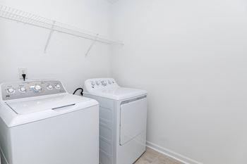 a laundry room with a washer and dryer