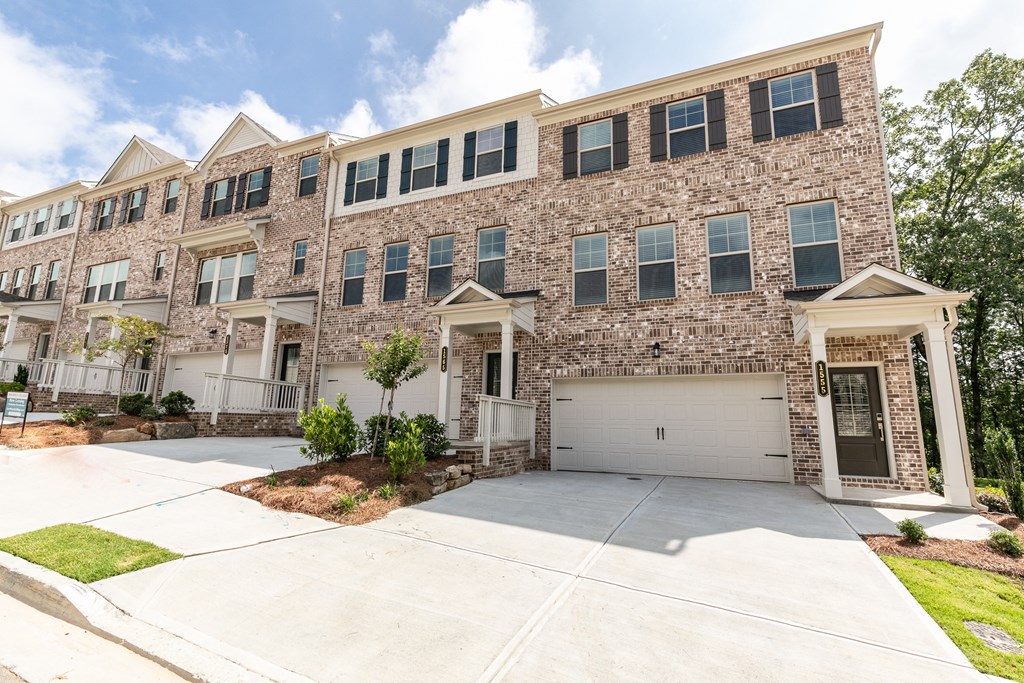 a large brick apartment building with a garage