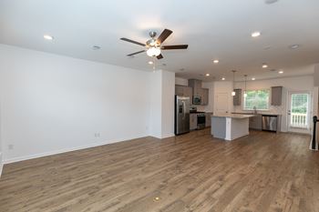 a kitchen and living room in a new home