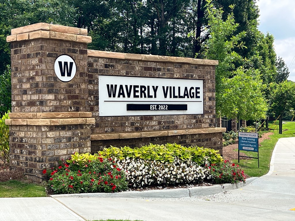 a sign at the entrance of waverly village