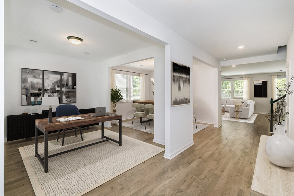 a living room with hardwood floors and white walls