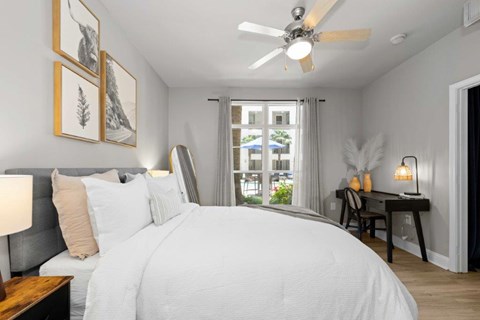 A Bedroom With a Large Bed at Mosaic South End Apartments, Charlotte, NC