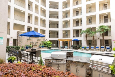 A Pool Area With a Grill at Mosaic South End Apartments, Charlotte, North Carolina