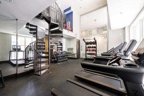 A Gym With Treadmills at Mosaic South End Apartments, North Carolina