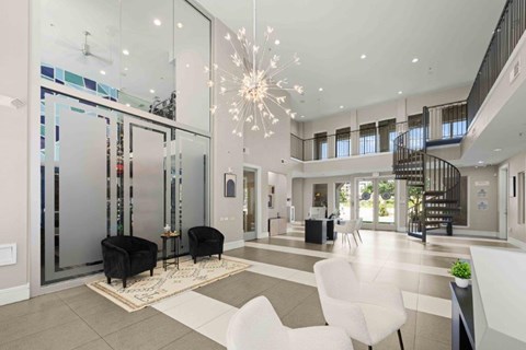A Living Room With Spiral Staircase at Mosaic South End Apartments, North Carolina