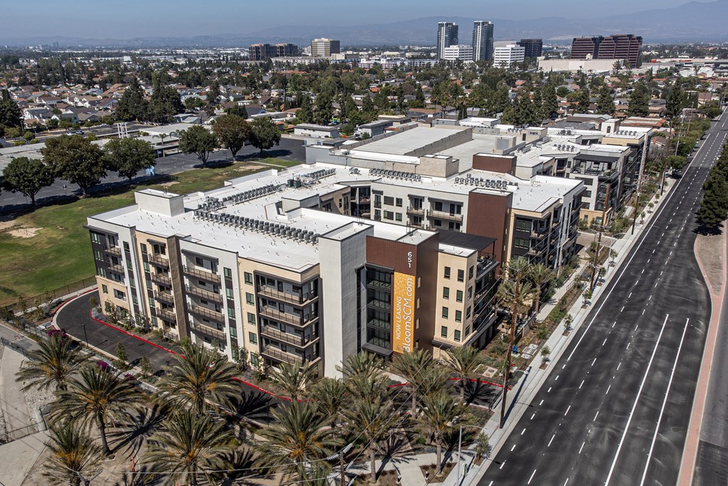 an aerial view of a large building in the middle of a city
