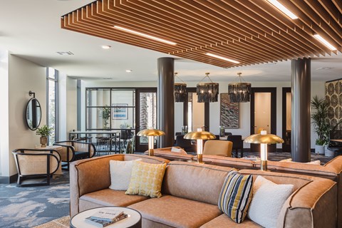 a living room filled with furniture and a large window