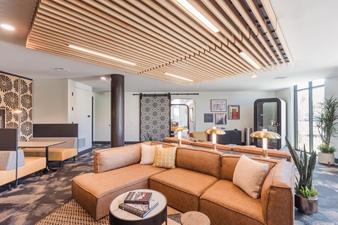 a living room filled with furniture and a large window