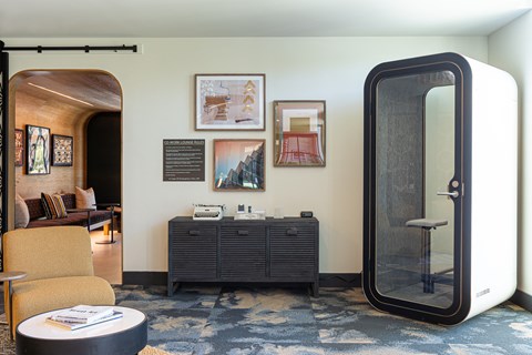 a room with an open door and a couch and dresser in front of it