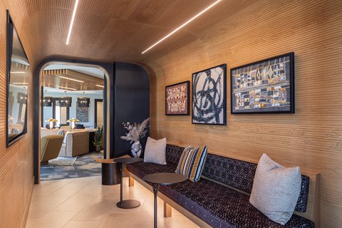 a seating area with a couch and tables